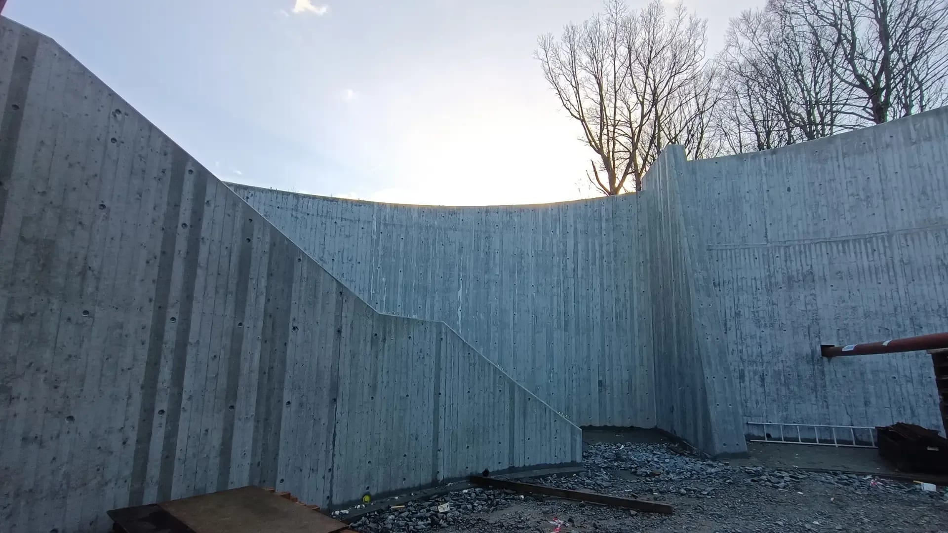 Stripped retaining walls with the board-marked finish showing.
