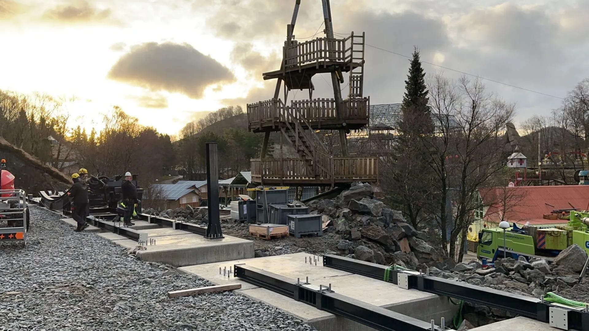 Concrete foundations beneath a ride at Kongeparken at sunset.